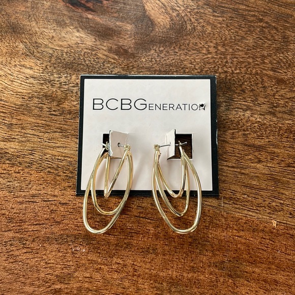 Gold hooped earrings never been worn BCBG - Picture 1 of 2